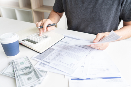 person budgeting and counting money