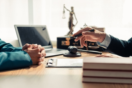 person consulting with a lawyer